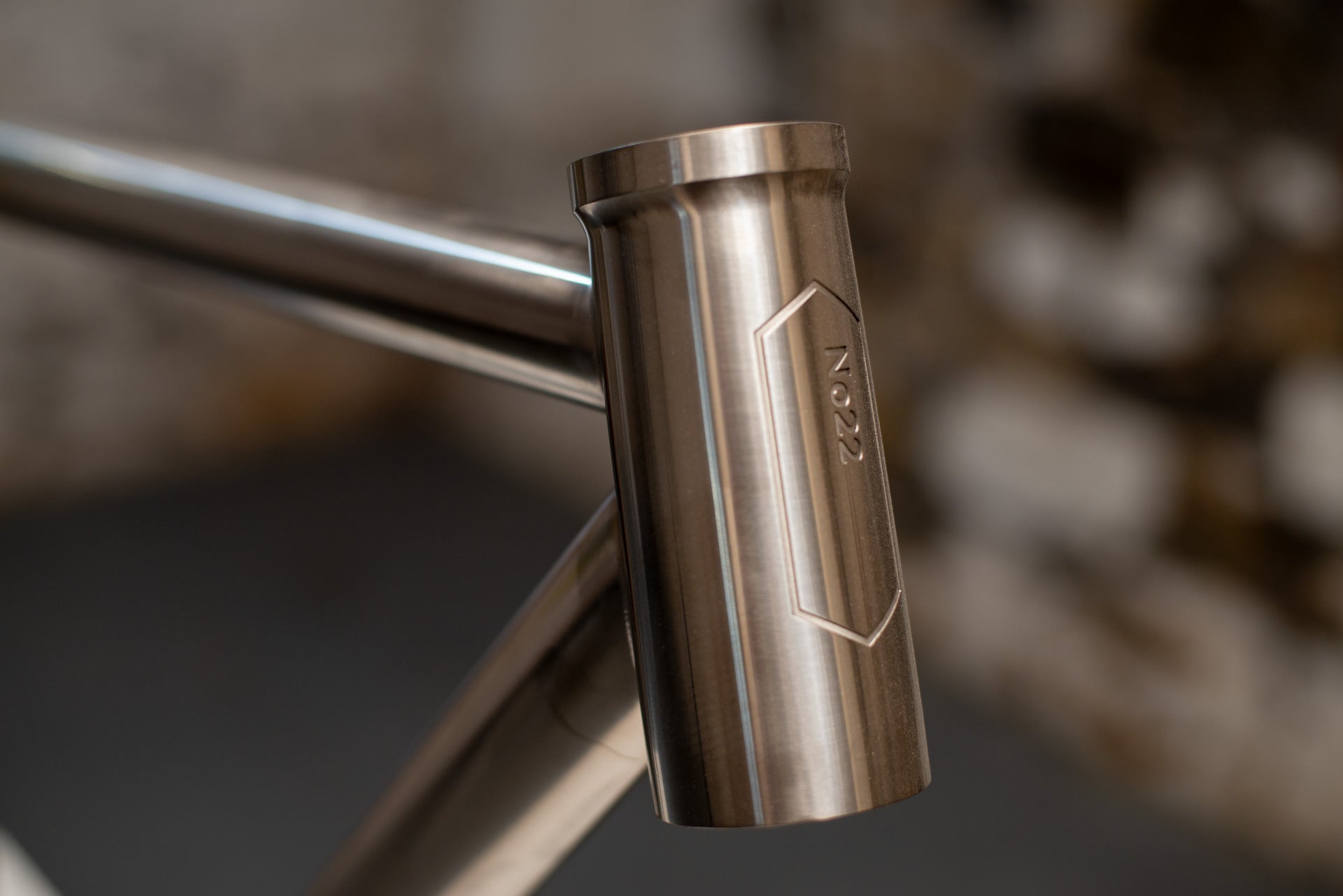 Head tube with engraved No. 22 badge, angled view